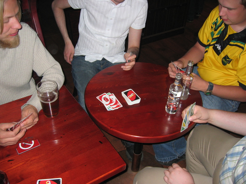 Next bar.. We borrowed a deck of cards from pooca, as we had to wait a while before our bus to Helsinki would leave. It was rather dark in that corner of the bar, and it was slightly difficult to differentiate between blue and green cards. Cell phones were a valuable light source ;)